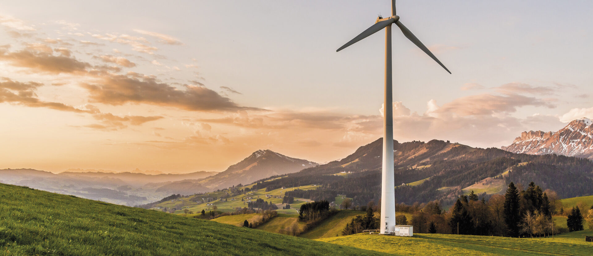 Simply Sustainable ESG and Sustainability Strategy Header. Wind turbine in hills and mountains