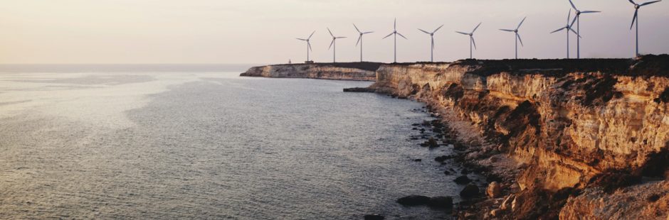 Wind turbines on a cliff near ocean