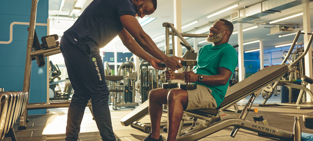 A gym instructor and customer in training session