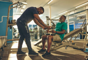 A gym instructor and customer in training session